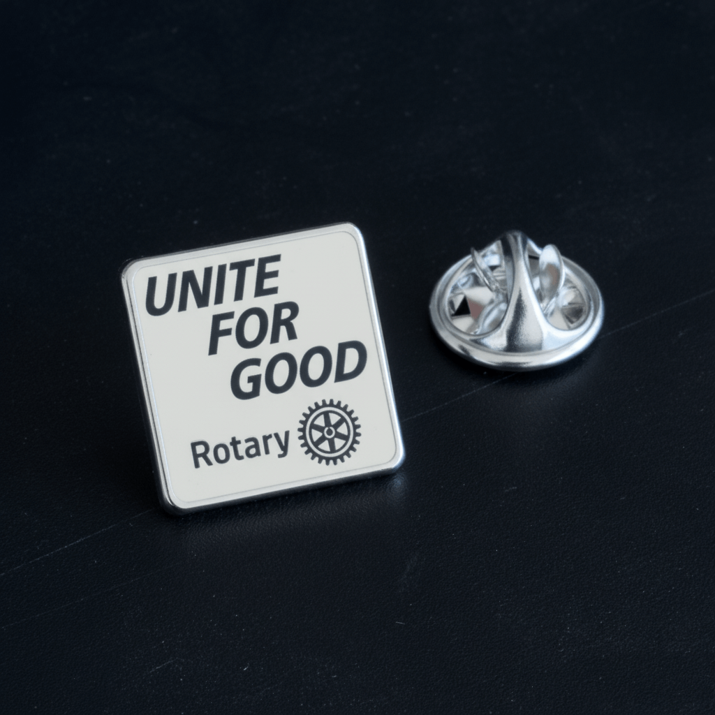 Insigna Rotary Unite for Good 2025-2026 finisaj argintiu 15x15mm